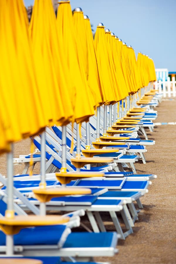 Sun beds in a row on beach. Sun beds in a row on beach.