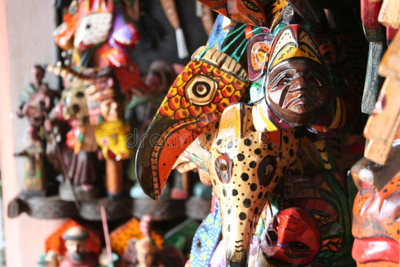 A wall of colorful indigenous masks for sale in the market in Antigua Guatemala. A wall of colorful indigenous masks for sale in the market in Antigua Guatemala