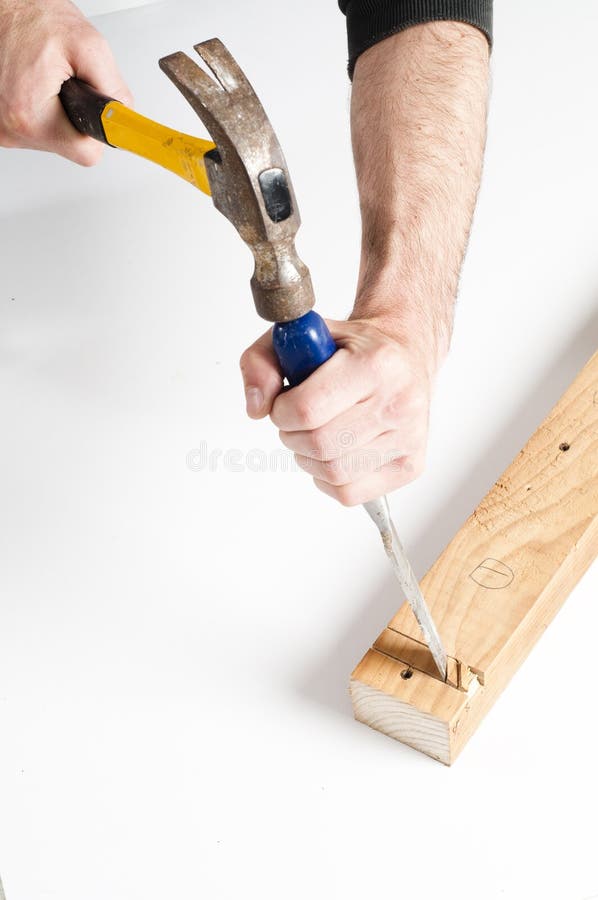 Close up of man using Chisel and hammer. Close up of man using Chisel and hammer