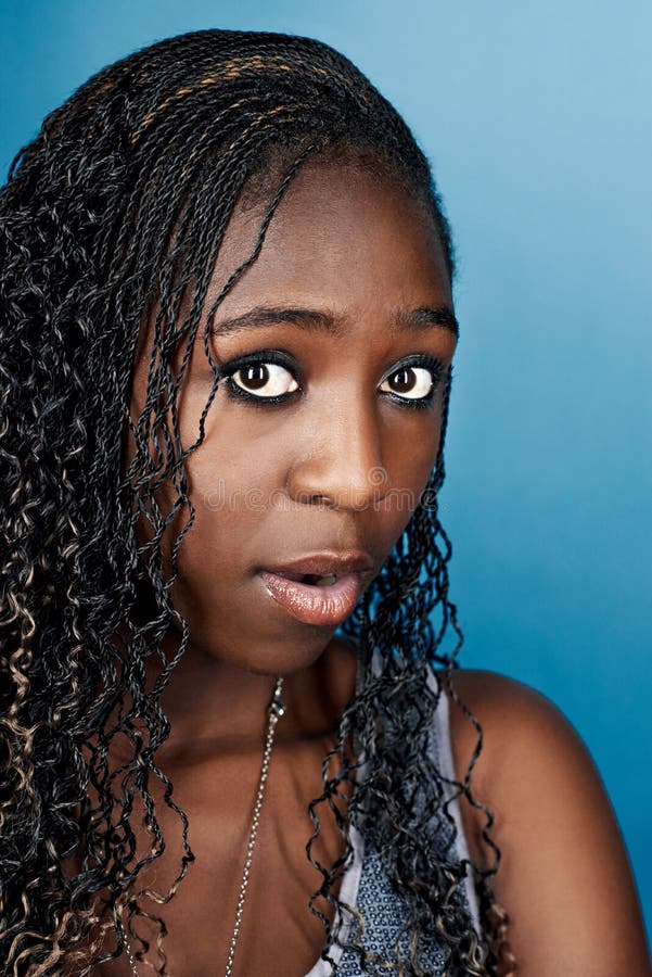 Portrait of real funny face african woman on blue background. Portrait of real funny face african woman on blue background