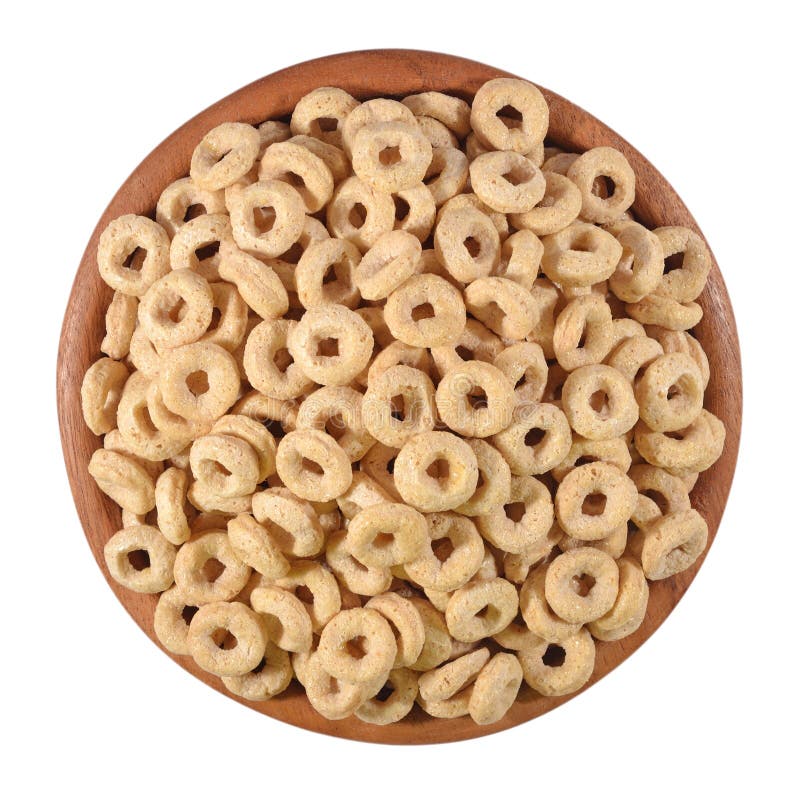 Breakfast cereal rings in a wooden bowl on a white background. Breakfast cereal rings in a wooden bowl on a white background