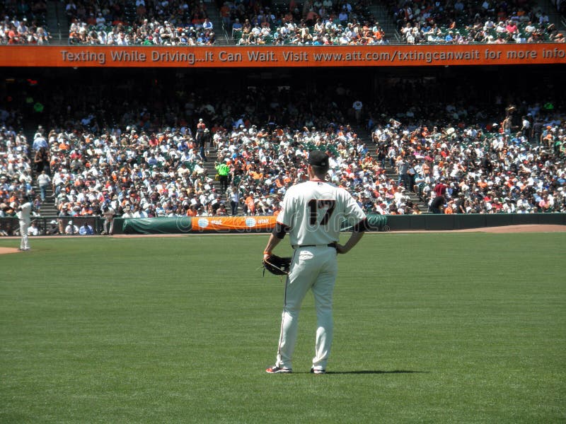 San Francisco Giants Vs. Los Angeles Dodgers: Giants Aubrey Huff stands in right field between plays. Ad about texting while driving on being displayed on scoreboard. Taken June 30 2010 at ATT Park in San Francisco California. San Francisco Giants Vs. Los Angeles Dodgers: Giants Aubrey Huff stands in right field between plays. Ad about texting while driving on being displayed on scoreboard. Taken June 30 2010 at ATT Park in San Francisco California.