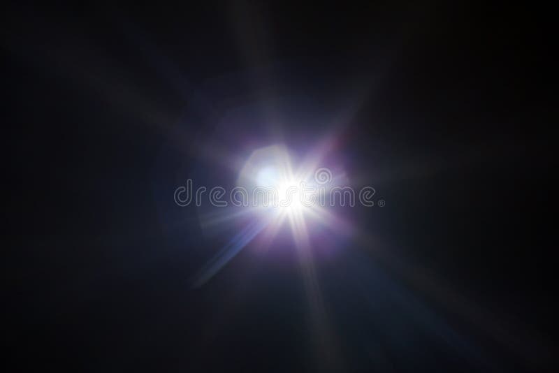 White light flare special effect in dark black. White light flare special effect in dark black