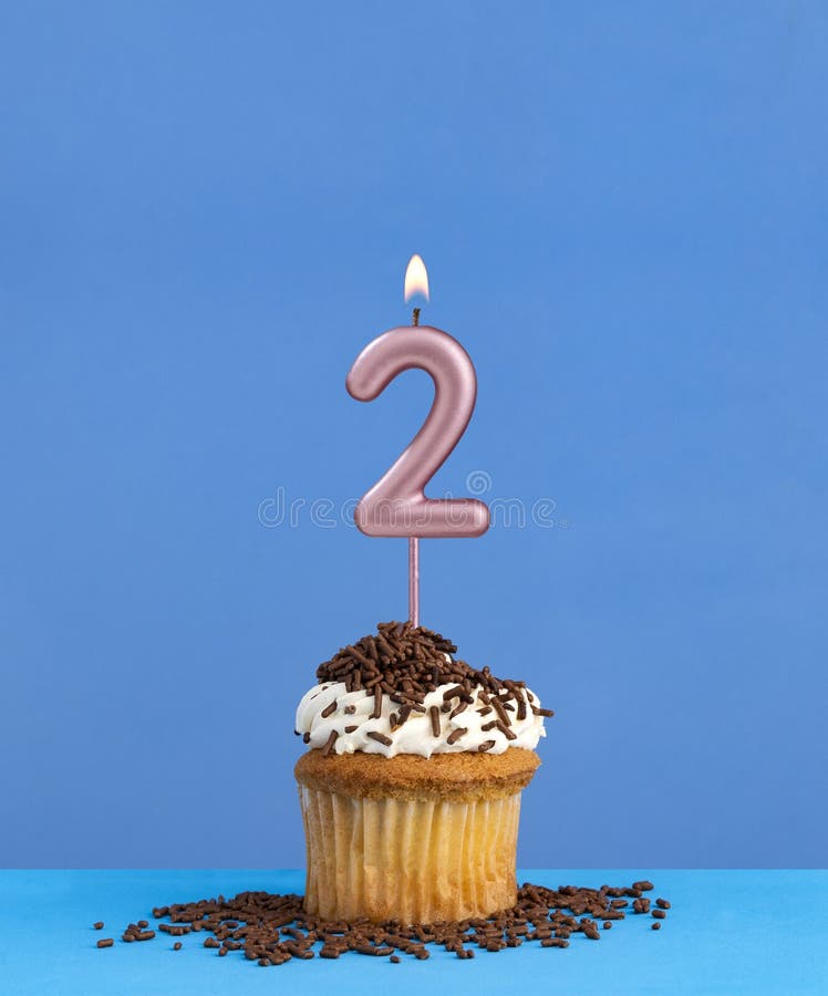 Candle number 2 - Birthday card with cupcake on blue background. Candle number 2 - Birthday card with cupcake on blue background