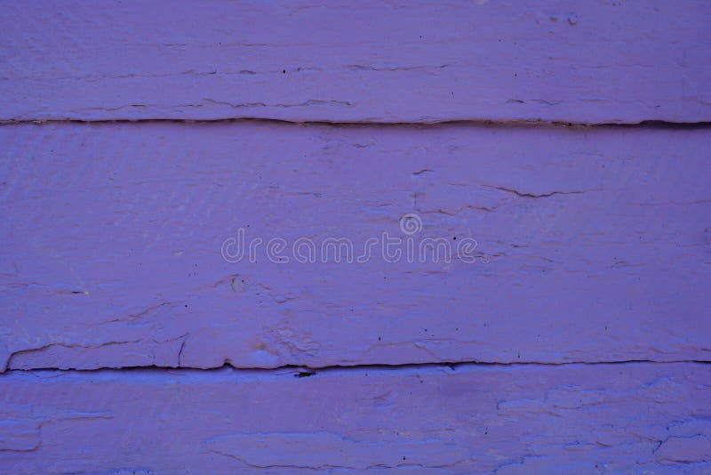 Beautiful closeup of a a wooden front door of a summer house. Violet background, wood wall painted in light purple. Lila wooden beams of a bungalow. Pattern of deep holes, straight lines in wood. Fresh painting, old door. Two horizontal lines, divide picture in 3 sectors. Beautiful closeup of a a wooden front door of a summer house. Violet background, wood wall painted in light purple. Lila wooden beams of a bungalow. Pattern of deep holes, straight lines in wood. Fresh painting, old door. Two horizontal lines, divide picture in 3 sectors