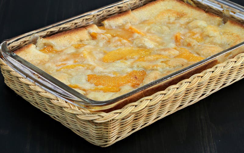 Peach cobbler fresh out of the oven. Macro shot with selective focus on corner. Peach cobbler fresh out of the oven. Macro shot with selective focus on corner.