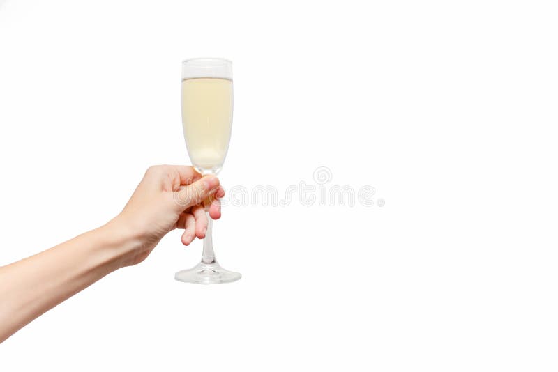 Female hand holding champagne glass. Holiday Concept. White background, isolated, close up. Female hand holding champagne glass. Holiday Concept. White background, isolated, close up