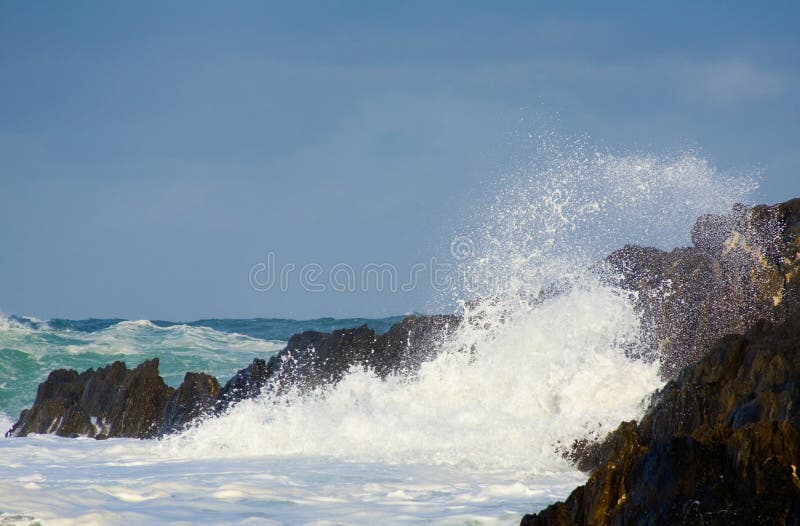 Wild surf hitting rocks on the shore. Wild surf hitting rocks on the shore