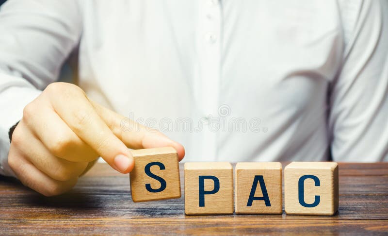 Man making SPAC word from blocks. in a row. A easy way stock exchange financial instrument for attracting investments. Development of new simplified procedures for attracting business investment. Man making SPAC word from blocks. in a row. A easy way stock exchange financial instrument for attracting investments. Development of new simplified procedures for attracting business investment