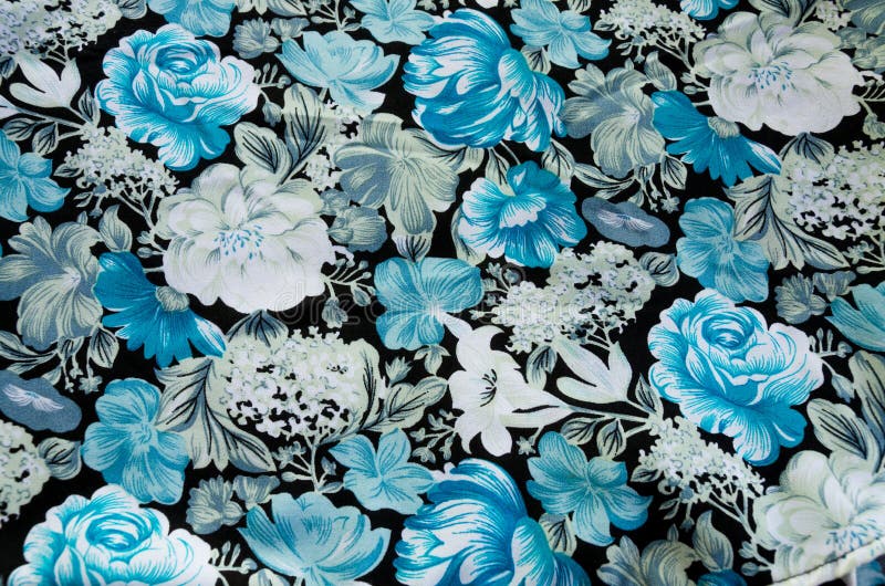 Beauty of fabric with blue and white flower pattern on black background. Beauty of fabric with blue and white flower pattern on black background