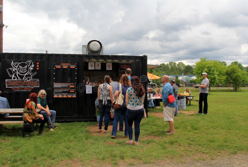 Groups of people waiting for food outside truck vendor, Elephant`s Trunk Flea Market, New Milford, CT, 2017. Groups of people waiting for food outside truck vendor, Elephant`s Trunk Flea Market, New Milford, CT, 2017.