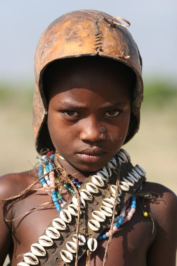 People of Africa, African boy looking shy at camera. Ethiopia. Africa. People of Africa, African boy looking shy at camera. Ethiopia. Africa.