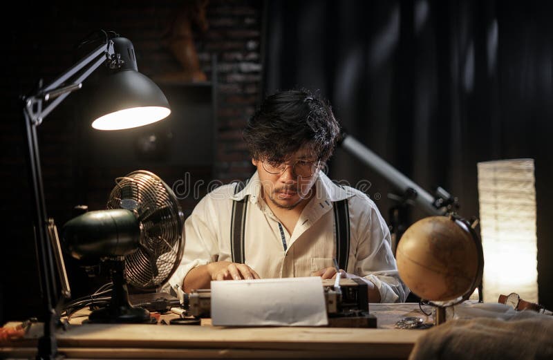 Man Typing on Old Typewriter 1950s Scene Setup. Man Typing on Old Typewriter 1950s Scene Setup.