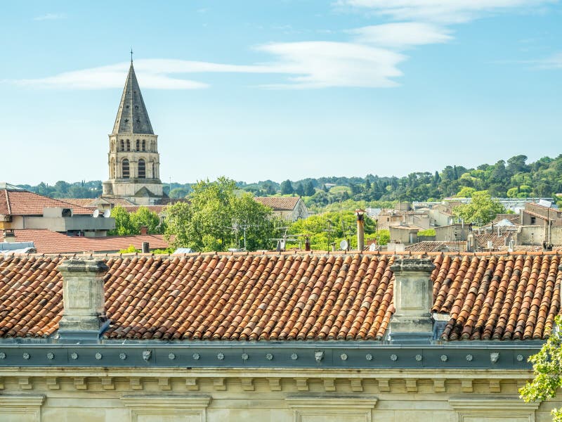 Cityscape view of Nimes in France, under cloudy blue sky. Cityscape view of Nimes in France, under cloudy blue sky