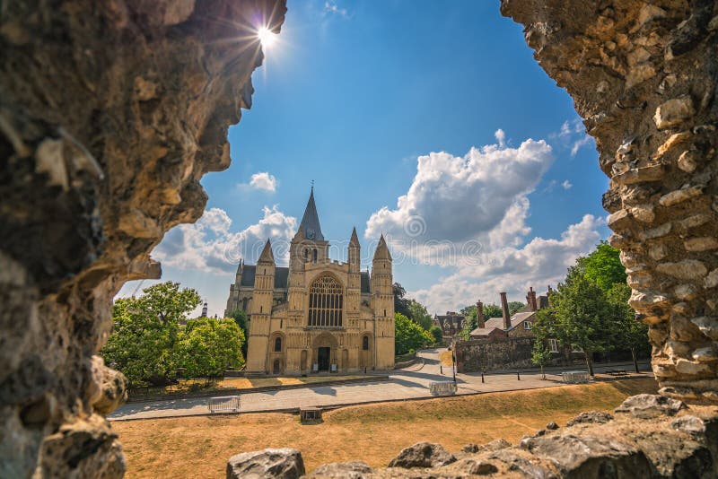 View of the magnificent Rochester Cathedral through the arched castle window, Kent, UK. View of the magnificent Rochester Cathedral through the arched castle window, Kent, UK