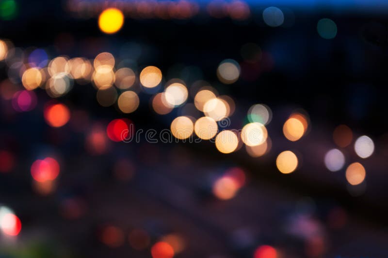 City and traffic light bokeh abstract Blur Background view from Above.Bokeh is the aesthetic quality of the blur produced in the out of focus points of light on parts of the image produced by a camera lens. City and traffic light bokeh abstract Blur Background view from Above.Bokeh is the aesthetic quality of the blur produced in the out of focus points of light on parts of the image produced by a camera lens.