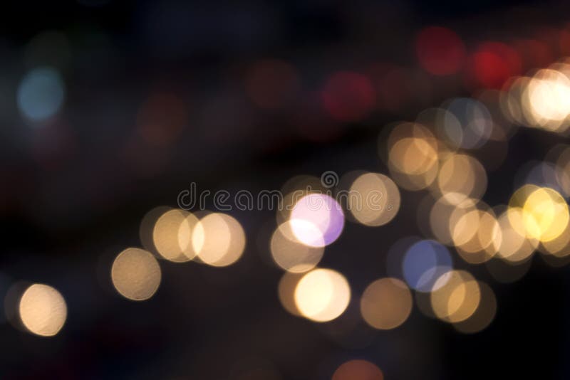 City and traffic light bokeh abstract Blur Background view from Above.Bokeh is the aesthetic quality of the blur produced in the out of focus points of light on parts of the image produced by a camera lens. City and traffic light bokeh abstract Blur Background view from Above.Bokeh is the aesthetic quality of the blur produced in the out of focus points of light on parts of the image produced by a camera lens.