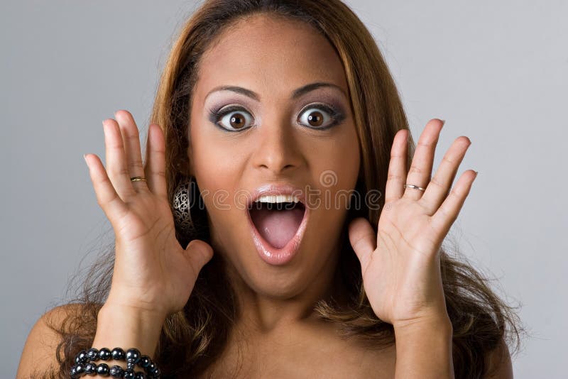 This young hispanic woman looks totally and completely surprised. This young hispanic woman looks totally and completely surprised.