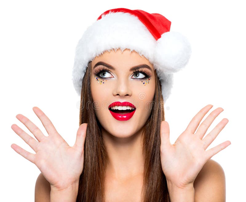 Έκπληκτη γυναίκα σε ένα καπέλο santa Πρόσωπο της όμορφης γυναίκας με το φωτεινό δημιουργικό makeup - που απομονώνεται στο άσπρο υ στοκ εικόνες με δικαίωμα ελεύθερης χρήσης Έκπληκτη γυναίκα σε ένα καπέλο santa Πρόσωπο της όμορφης γυναίκας με το φωτεινό δημιουργικό makeup - που απομονώνεται στο άσπρο υ στοκ εικόνες με δικαίωμα ελεύθερης χρήσης