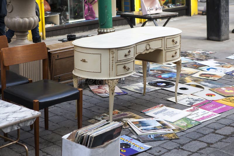 London, UK - November 2019, An old white vintage chest of drawers and records on the street at Brick Lane`s Sunday flea market. London, UK - November 2019, An old white vintage chest of drawers and records on the street at Brick Lane`s Sunday flea market