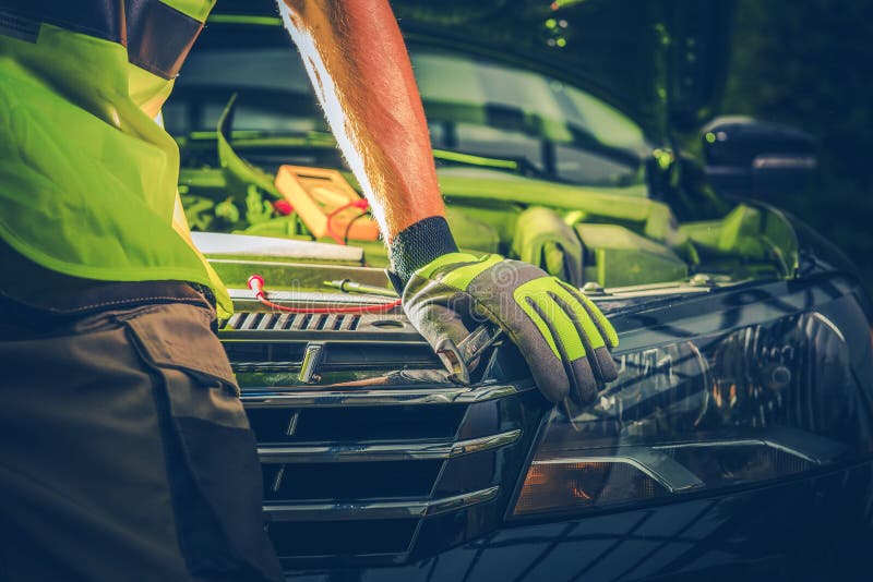 Car Repair Photo Concept. Mechanic Working To Fix Modern Car. Closeup Photo. Car Repair Photo Concept. Mechanic Working To Fix Modern Car. Closeup Photo.