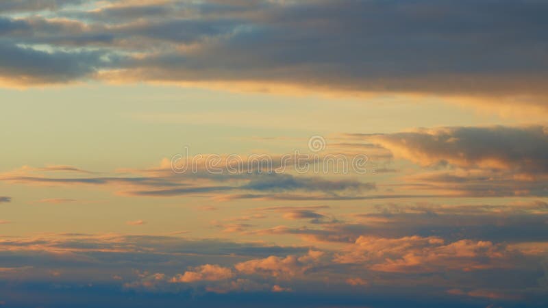 Timelapse. Warm dramatic clouds in red tones. Sunset cloud shot over clouds. Timelapse. Warm dramatic clouds in red tones. Sunset cloud shot over clouds.