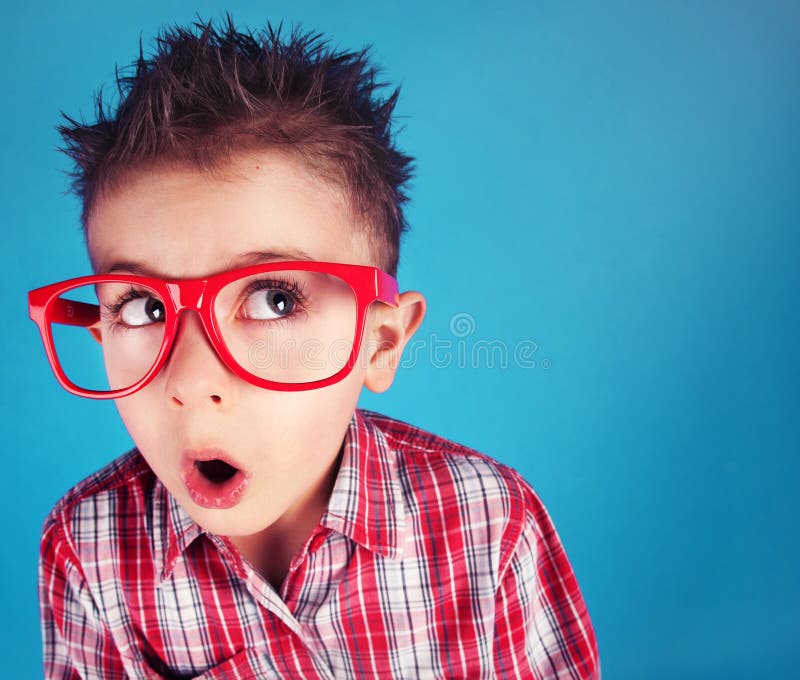 Surprised five years old boy wearing glasses. Surprised five years old boy wearing glasses