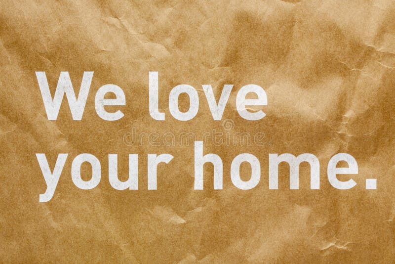 We love your home text on wrinkled paper texture background. We love your home text on wrinkled paper texture background