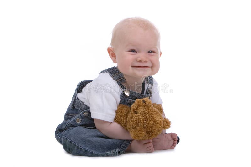 Baby boy in jeans looking into camera. Baby boy in jeans looking into camera