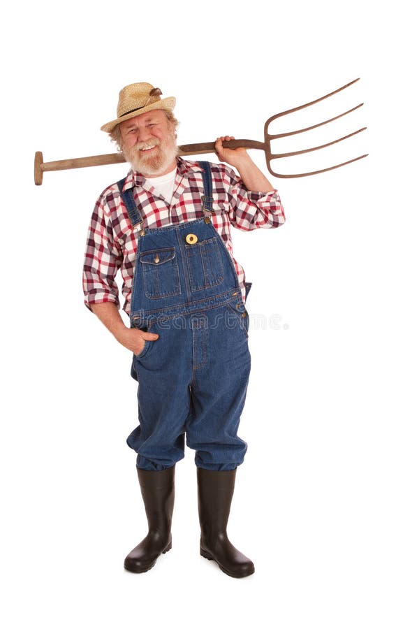 Smiling senior farmer with straw hat, plaid shirt, bib overalls, lifting pitchfork over one shoulder. Vertical layout, isolated on white background with copy space. Smiling senior farmer with straw hat, plaid shirt, bib overalls, lifting pitchfork over one shoulder. Vertical layout, isolated on white background with copy space.