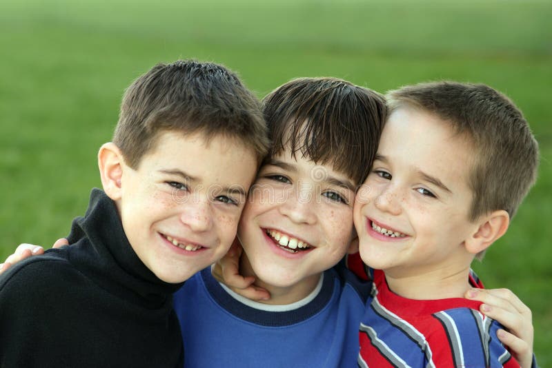 Group of three brothers smiling. Group of three brothers smiling