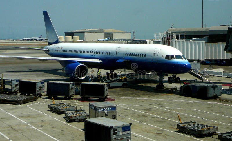 Passenger jet waiting at the airport terminal for departure. Passenger jet waiting at the airport terminal for departure