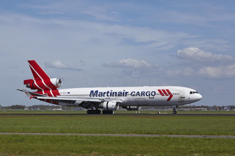 A McDonnell Douglas MD-11F of Martinair Cargo lands at Amsterdam Airport Schiphol (The Netherlands, AMS) on May 4, 2015. The name of the runway is Polderbaan. A McDonnell Douglas MD-11F of Martinair Cargo lands at Amsterdam Airport Schiphol (The Netherlands, AMS) on May 4, 2015. The name of the runway is Polderbaan.