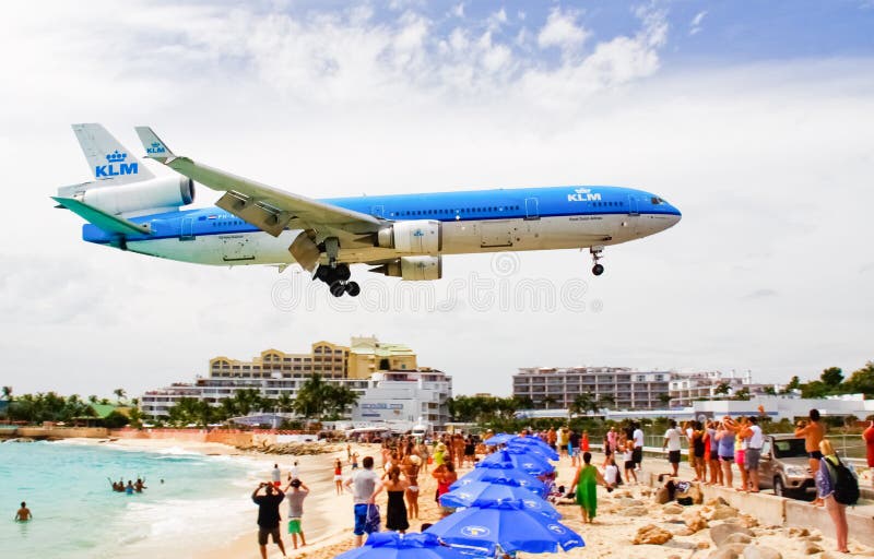 A KLM Royal Dutch Airlines flight flys over onlookers at Maho Bay beach as it arrives at Princess Juliana International Airport in St. Maarten in the Netherlands Antilles, or Dutch West Indies. A KLM Royal Dutch Airlines flight flys over onlookers at Maho Bay beach as it arrives at Princess Juliana International Airport in St. Maarten in the Netherlands Antilles, or Dutch West Indies.