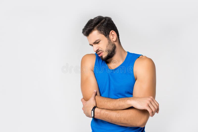 αθλητικός νεαρός άνδρας με τον πόνο βραχιόνων στοκ φωτογραφίες με δικαίωμα ελεύθερης χρήσης αθλητικός νεαρός άνδρας με τον πόνο βραχιόνων στοκ φωτογραφίες με δικαίωμα ελεύθερης χρήσης