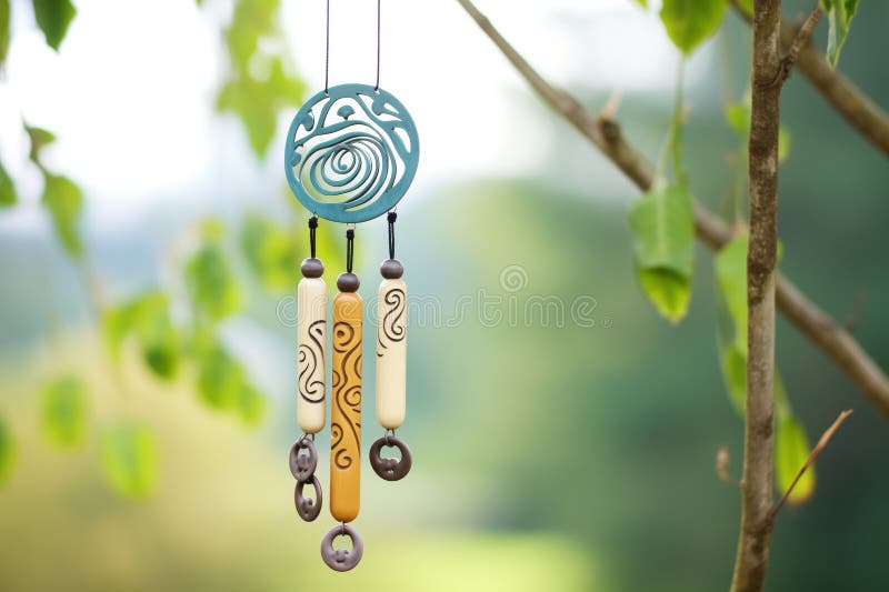 aluminium tube wind chimes with nature motifs carved on, created with generative ai AI generated. aluminium tube wind chimes with nature motifs carved on, created with generative ai AI generated