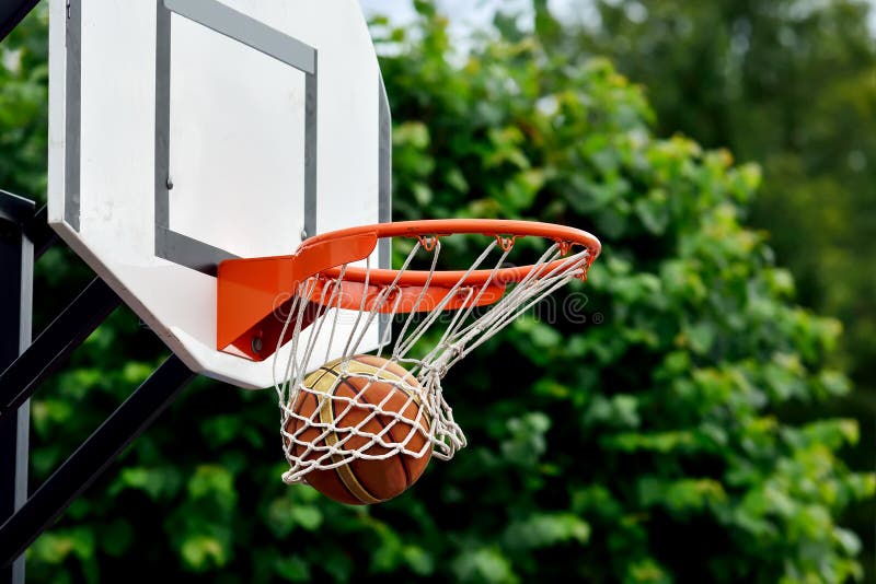 Basketball ball flies into the net. Basketball ball flies into the net