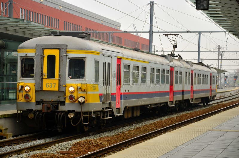 A local Belgian electric commuter train railcar stands at a platform at Brugge station. Belgium has an extensive rail network. It is a member of the International Union of Railways (UIC). In 2003, the network constituted 3,518 km of railways, all of which were standard gauge: 1,435 mm (4 ft 8 1⁄2 in) gauge. Of all of those railways, 2,631 km were also electrified. Most electrified Belgian lines use a 3,000 volt d.c. overhead power supply, but the high speed-lines are electrified at 25,000 volt a.c., as are recent electrifications in the south of the country (Rivage - Gouvy and Dinant - Athus lines). A local Belgian electric commuter train railcar stands at a platform at Brugge station. Belgium has an extensive rail network. It is a member of the International Union of Railways (UIC). In 2003, the network constituted 3,518 km of railways, all of which were standard gauge: 1,435 mm (4 ft 8 1⁄2 in) gauge. Of all of those railways, 2,631 km were also electrified. Most electrified Belgian lines use a 3,000 volt d.c. overhead power supply, but the high speed-lines are electrified at 25,000 volt a.c., as are recent electrifications in the south of the country (Rivage - Gouvy and Dinant - Athus lines).