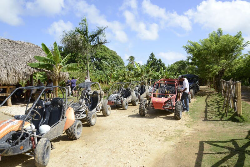 Dune buggies sitting empty on the island of the Dominican Republic. The dune buggy is a popular tourist attraction on this island and a way for tourists to see the local culture. Dune buggies sitting empty on the island of the Dominican Republic. The dune buggy is a popular tourist attraction on this island and a way for tourists to see the local culture.