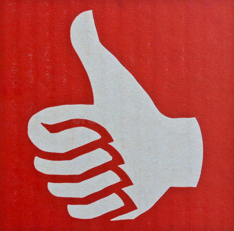 Thumb up , Like symbol in red background on cardboard. Thumb up , Like symbol in red background on cardboard