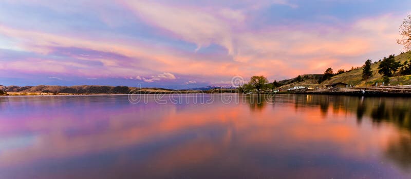 A scenic sunset reflected in the water of Hauser Lake in Montana, USA. A scenic sunset reflected in the water of Hauser Lake in Montana, USA