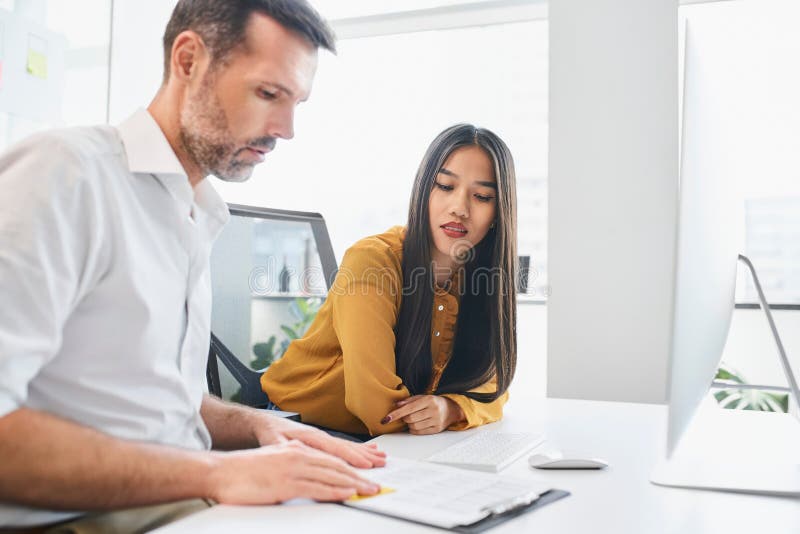 Employee performance review. Manager discussing future development during one 2 one meeting. Employee performance review. Manager discussing future development during one 2 one meeting