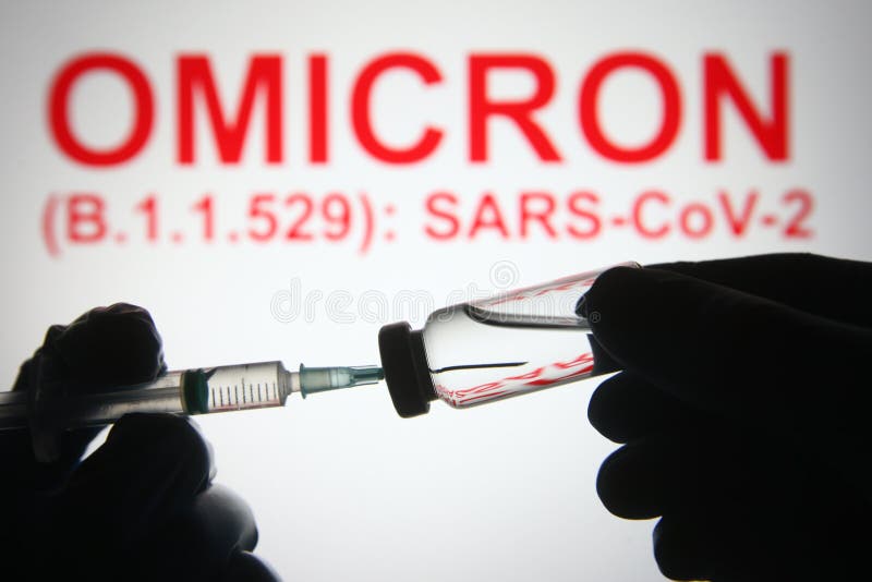 In this photo illustration of a new COVID-19 variant a medical syringe and a vial are seen and Omicron B.1.1.529: SARS-CoV-2 words in the white background. In this photo illustration of a new COVID-19 variant a medical syringe and a vial are seen and Omicron B.1.1.529: SARS-CoV-2 words in the white background