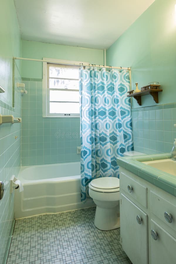 Simple dated 1950s bathroom with green checkered tile. Simple dated 1950s bathroom with green checkered tile.