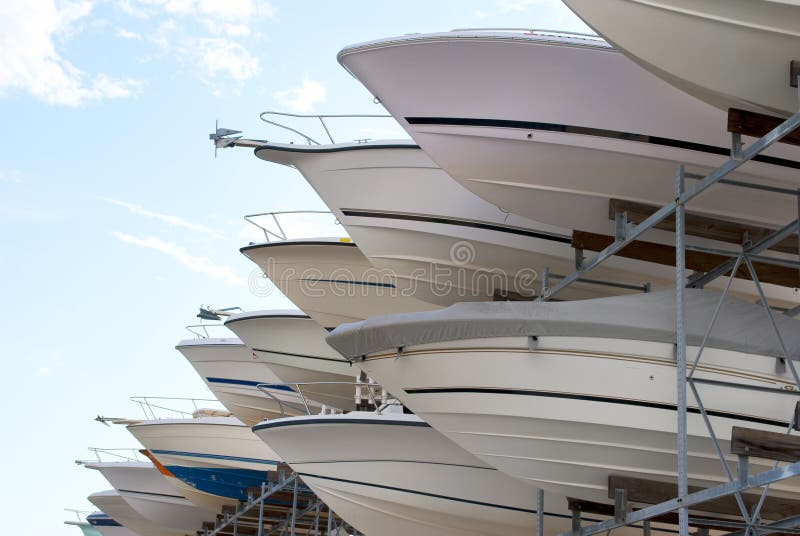 The bows of boats sticking out of a boat storage rack in a marina. The bows of boats sticking out of a boat storage rack in a marina