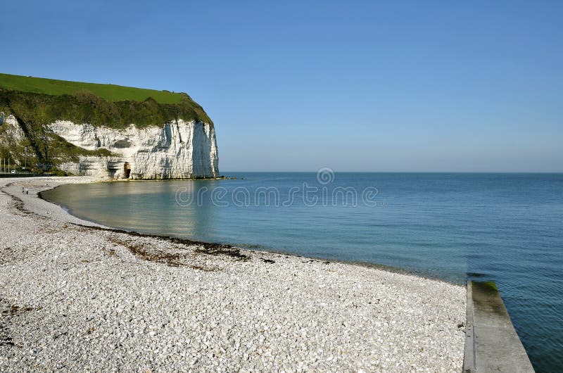Pebble beach and cliff at Yport, commune in the Seine-Maritime department in the Haute-Normandie region in northwestern France. Pebble beach and cliff at Yport, commune in the Seine-Maritime department in the Haute-Normandie region in northwestern France