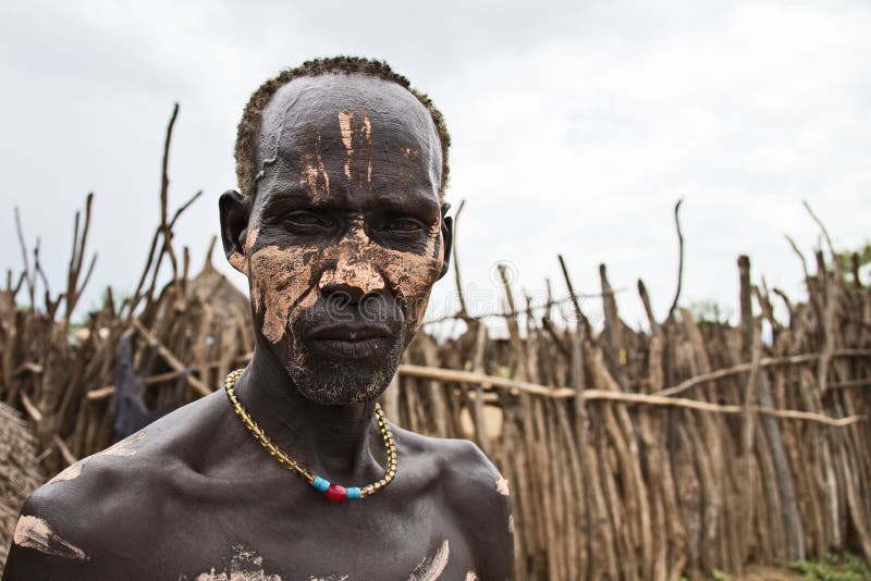 The Karo, or Kara, are a Nilotic ethnic group in Ethiopia famous for their body painting. They are also one of the smallest tribes in the region with an estimated population of 1.000-1.200 people. They are closely related to their neighbors, Hamer and Banna, with a lexical similarity of 81 They live along the east banks of the Omo River in southern Ethiopia and survive on agriculture and natural annual flooding. They have had the same culture and traditions for 500 years, like traditional dancing and painting their bodies with a mix of ash and fat or water.The Karo people differentiate themselves from many of the neighbouring tribes by excelling specifically in body and face painting. They paint themselves daily with coloured ochre, white chalk, yellow mineral rock, charcoal, and pulverized iron ore, all natural resources local to the area. The specific designs drawn on their bodies can change daily and vary in content, ranging from simple stars or lines to animal motifs, such as guinea fowl plumage, or to the most popular – a myriad of handprints covering the torso and legs. Both the Karo and the Hamar men use clay to construct elaborate hairstyles and headdresses for themselves, signifying status, beauty, and bravery.The photo is part of the album `SECOND ETHIOPIAN TRIBES EXPEDITION`. The Karo, or Kara, are a Nilotic ethnic group in Ethiopia famous for their body painting. They are also one of the smallest tribes in the region with an estimated population of 1.000-1.200 people. They are closely related to their neighbors, Hamer and Banna, with a lexical similarity of 81 They live along the east banks of the Omo River in southern Ethiopia and survive on agriculture and natural annual flooding. They have had the same culture and traditions for 500 years, like traditional dancing and painting their bodies with a mix of ash and fat or water.The Karo people differentiate themselves from many of the neighbouring tribes by excelling specifically in body and face painting. They paint themselves daily with coloured ochre, white chalk, yellow mineral rock, charcoal, and pulverized iron ore, all natural resources local to the area. The specific designs drawn on their bodies can change daily and vary in content, ranging from simple stars or lines to animal motifs, such as guinea fowl plumage, or to the most popular – a myriad of handprints covering the torso and legs. Both the Karo and the Hamar men use clay to construct elaborate hairstyles and headdresses for themselves, signifying status, beauty, and bravery.The photo is part of the album `SECOND ETHIOPIAN TRIBES EXPEDITION`