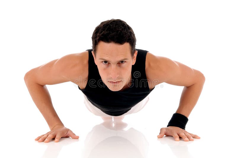 Young handsome male athlete working out, fitness Studio shot. Young handsome male athlete working out, fitness Studio shot.