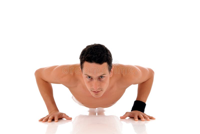 Young handsome male athlete working out, fitness Studio shot. Young handsome male athlete working out, fitness Studio shot.