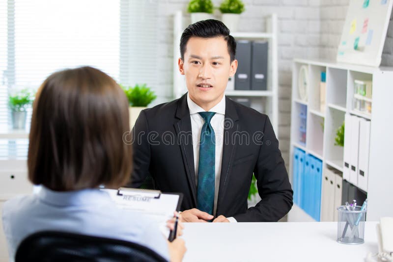 Confident asian man talk to female interviewer for a job interview. Confident asian man talk to female interviewer for a job interview